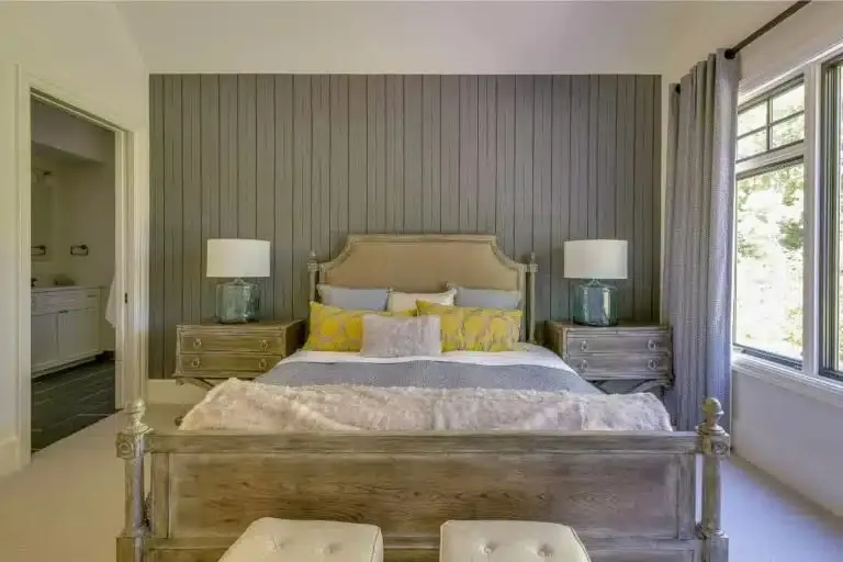 A living room with a single accent wall in a deeper color