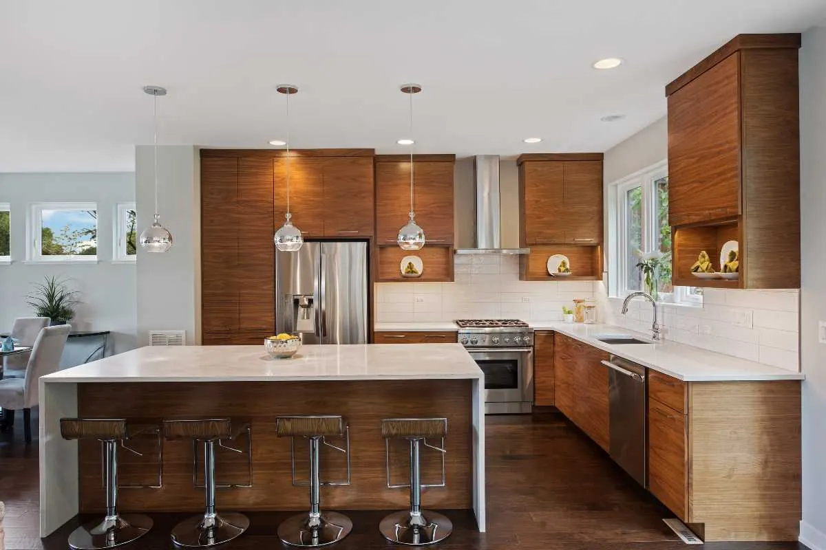 A kitchen with warm brown cabinets and neutral painted walls